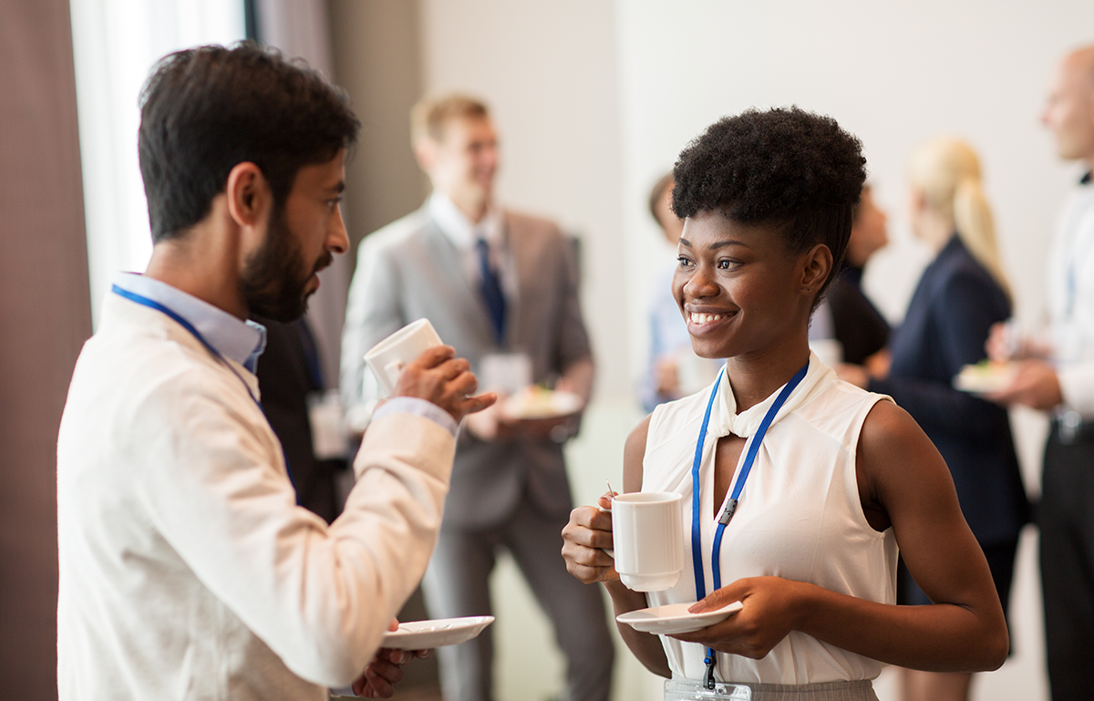 Image of man and woman talking over coffee